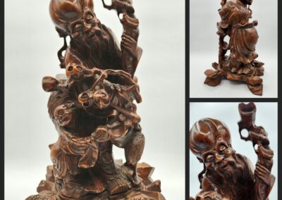 Intricate wooden sculpture of a bearded figure.