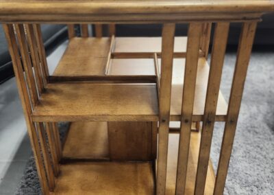 Wooden side table with multiple shelves.