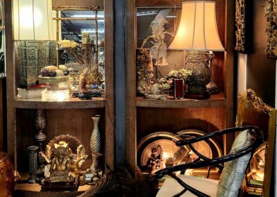 Cozy room with decorative shelves and chair.