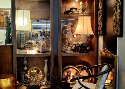 Decorative room corner with wooden shelves, chair.