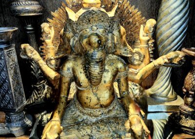 Elephant deity statue with multiple arms displayed.