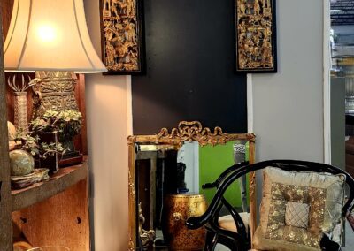 Decorative chair and lamp in cozy corner.