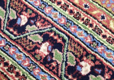 Colorful geometric patterned woven textile design.