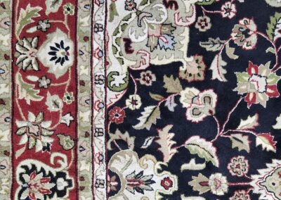 Intricate floral patterned oriental rug design.