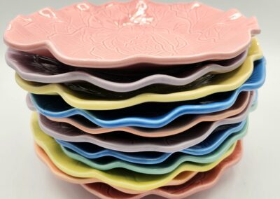 Stack of colorful flower-shaped plates.