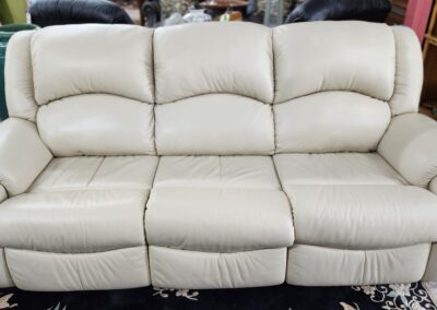 Beige leather sofa in a living room.