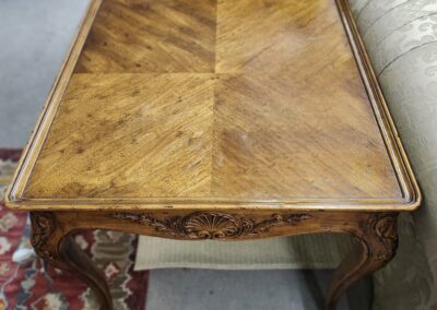Ornate wooden table with carved legs.