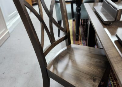 Wooden chair at a dining table.