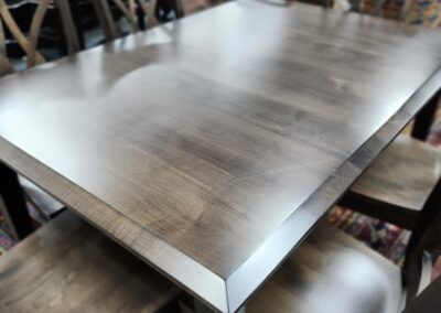 Wooden dining table with matching chairs.