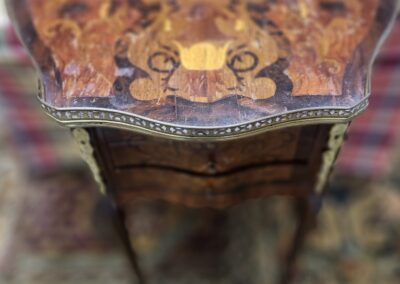 Ornate wooden table with intricate inlay design.