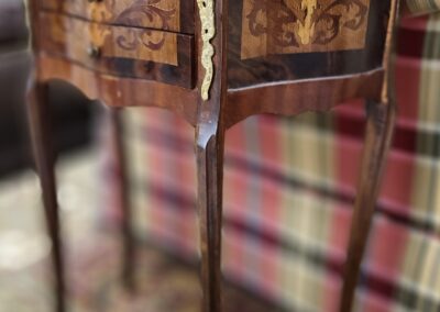 Ornate wooden table with decorative inlays.