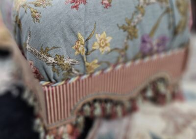 Floral patterned fabric with fringed trim.