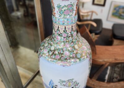 Decorative floral vase with intricate painted designs.