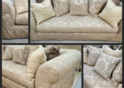 Elegant beige sofa with decorative pillows.