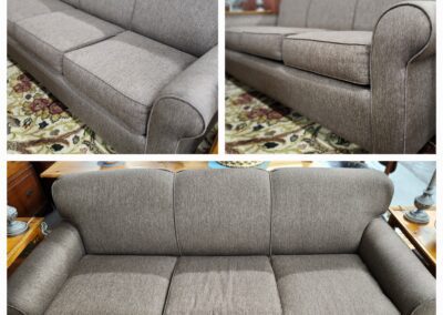 Brown fabric sofa with rolled arms.