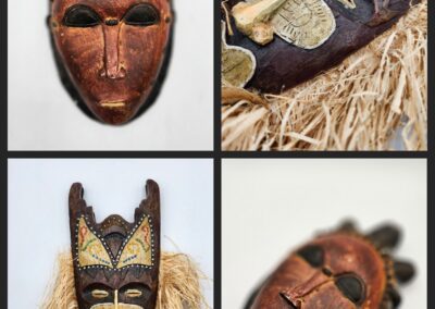 Four traditional tribal masks with intricate designs.