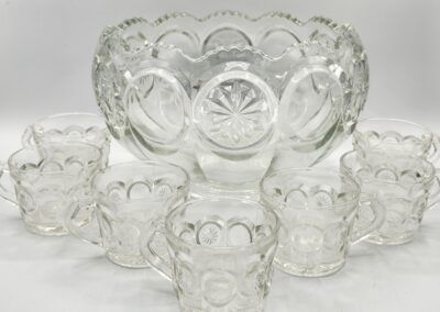 Glass punch bowl set with matching cups.
