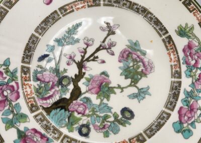 Floral patterned porcelain plate with intricate design.