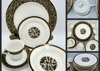 Black and gold floral dinnerware set.