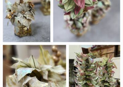 Decorative artificial trees with metallic leaves.