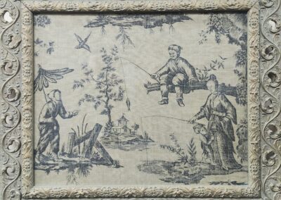 Vintage pastoral scene in ornate frame.