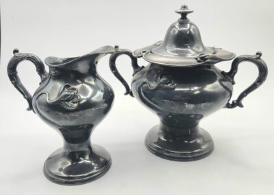 Elegant silver cream and sugar set.