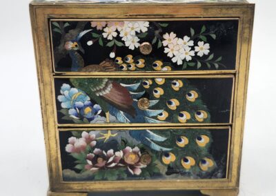 Decorative mini chest with floral design.