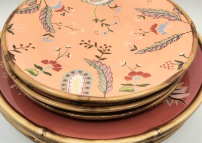 Stack of floral patterned ceramic plates.