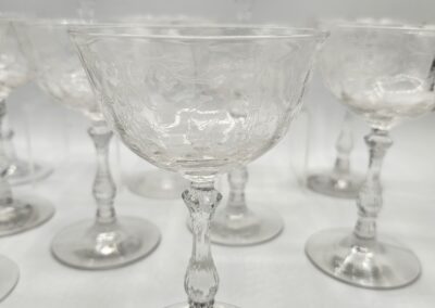 Crystal wine glasses with intricate designs displayed.