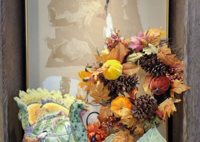 Autumn-themed decoration with turkey and wreath.