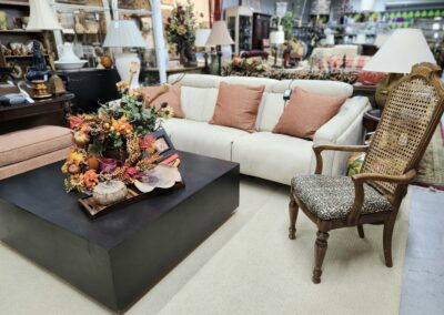 Living room furniture with floral centerpiece.