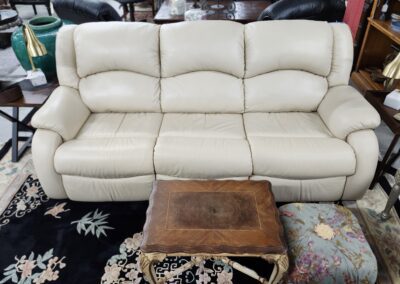 Beige sofa with wooden coffee table.
