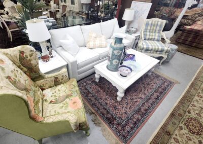 Living room furniture with floral accents displayed.