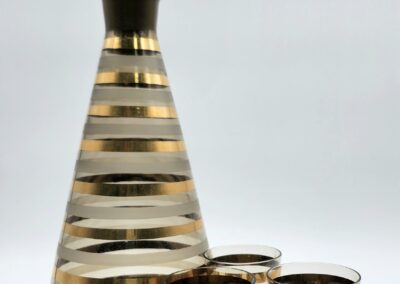 Striped glass decanter with matching glasses.