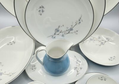 White and blue floral porcelain dinnerware set.