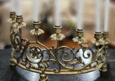 Ornate golden candelabra with floral design.