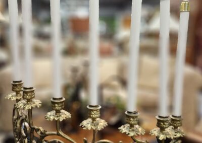 Ornate brass candelabra with tall candles.