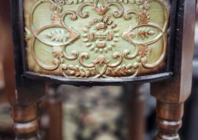 Ornate wooden furniture with carved floral design.