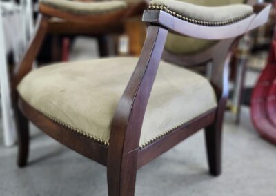 Elegant wooden chair with upholstered seat.