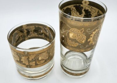 Two glasses with intricate gold patterns.