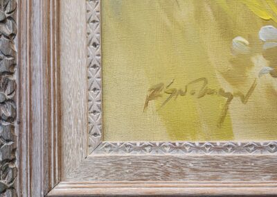 Ornate wooden frame with yellow painting detail.