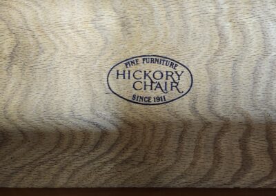 Wooden surface with Hickory Chair logo.