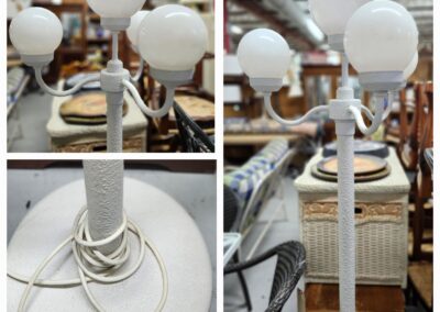 White three-globe floor lamp in store.