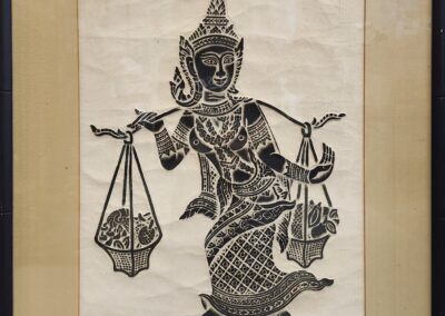 Intricate Thai artwork of a traditional figure.
