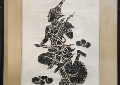 Traditional Thai shadow puppet art in frame.