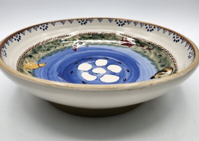 Decorative ceramic bowl with painted design.