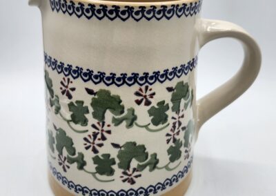 Decorative ceramic jug with floral patterns.