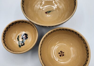 Three decorative ceramic bowls with patterns.