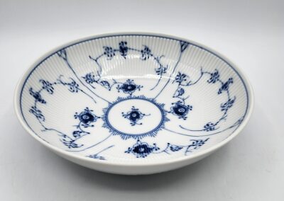 White ceramic bowl with blue floral pattern.