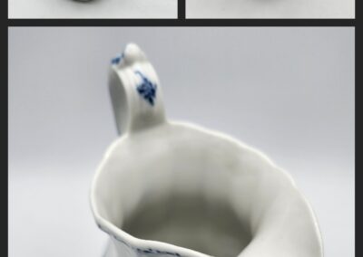 White ceramic jug with blue floral design.